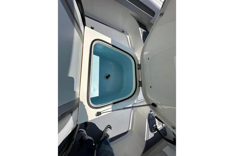 Slide: The Image of Open storage compartment on 2020 Blackwood 270 LXF boat, showcasing interior space. - 15