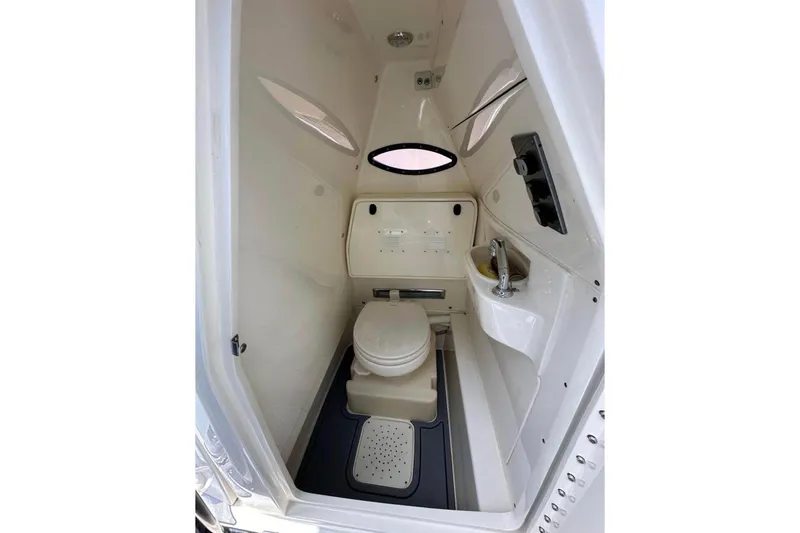 Slide: The Image of 2020 Blackwood 270 LXF boat interior bathroom with toilet and sink. - 18