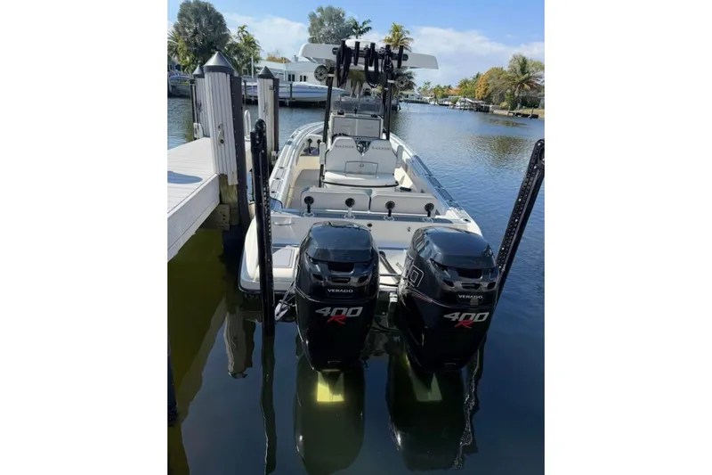 Slide: The Image of 2020 Blackwood 270 LXF boat docked with dual 400R Verado engines. - 2