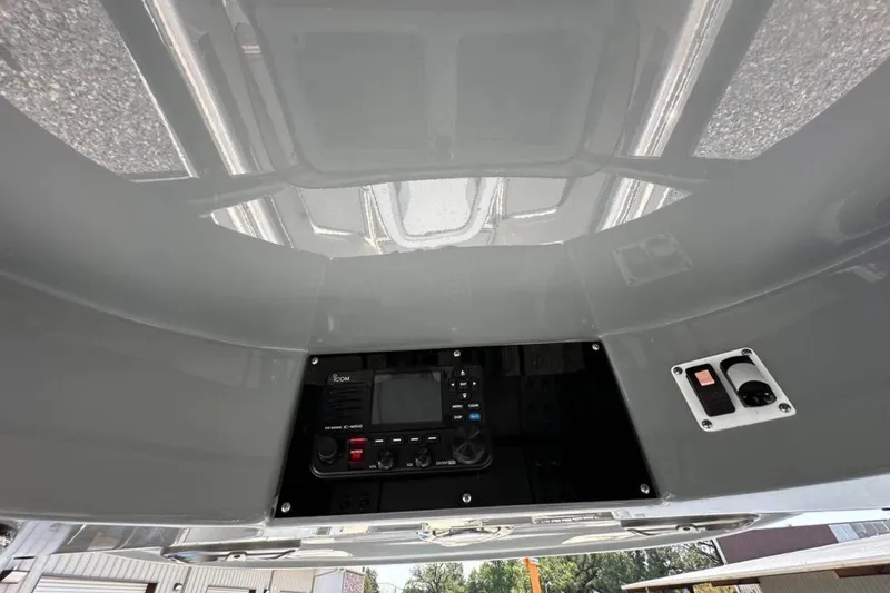 Slide: The Image of 2020 Blackwood 270 LXF boat dashboard with electronic controls and switches. - 5