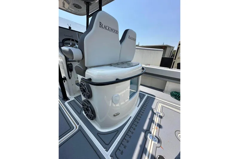 Slide: The Image of 2020 Blackwood 270 LXF boat interior with seating and speakers. - 7