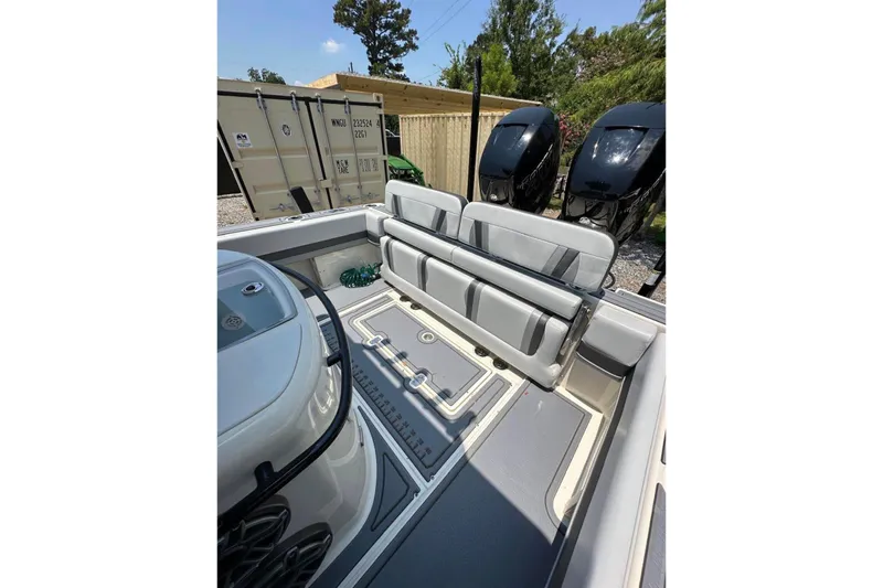 Slide: The Image of 2020 Blackwood 270 LXF boat interior with seating and dual outboard motors. - 9