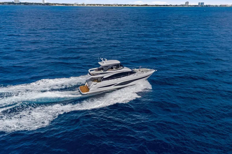Slide: The Image of Luxurious 2026 Princess F65 yacht cruising on open blue sea. - 11