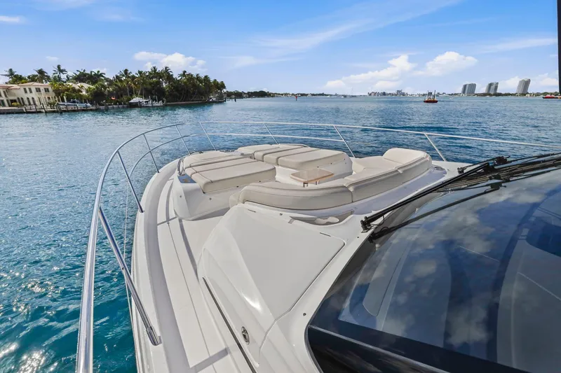 Slide: The Image of Luxurious 2026 Princess F65 yacht cruising on serene blue waters under a clear sky. - 16