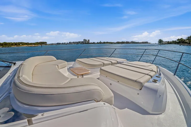 Slide: The Image of Luxurious 2026 Princess F65 yacht deck with plush seating, overlooking serene blue waters. - 19