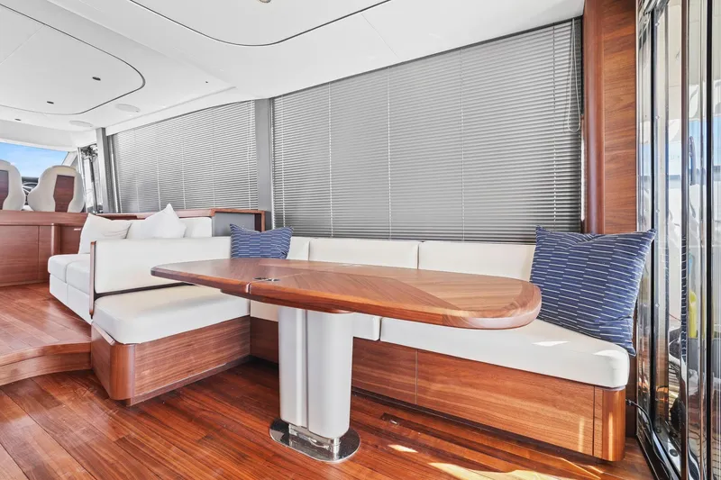Slide: The Image of Luxurious interior of 2026 Princess F65 yacht with elegant wood and white seating. - 29