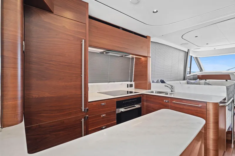 Slide: The Image of Luxurious kitchen interior of 2026 Princess F65 yacht with sleek wood finishes. - 34