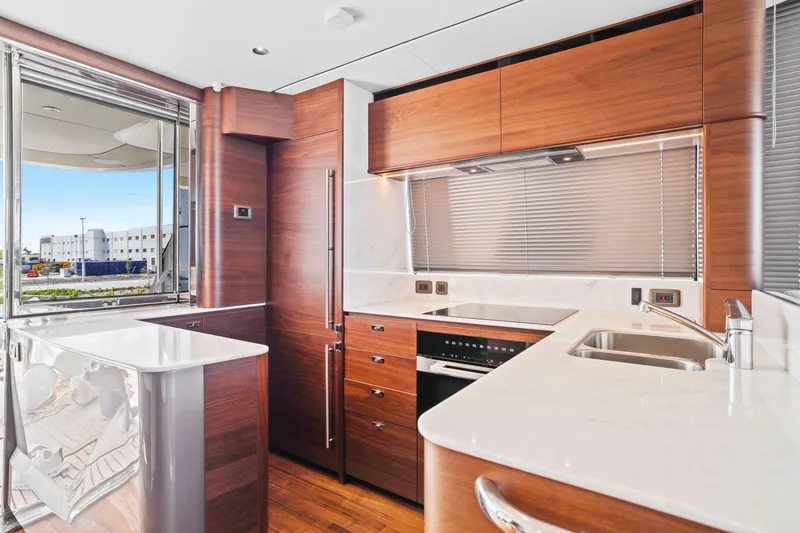 Slide: The Image of Luxurious kitchen interior of 2026 Princess F65 yacht with modern wood cabinetry and sleek appliances. - 35