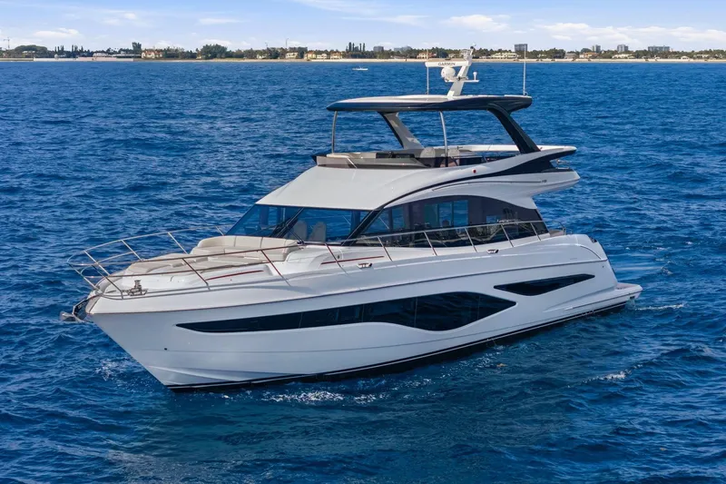 Slide: The Image of Luxurious 2026 Princess F65 yacht cruising on open blue sea. - 4