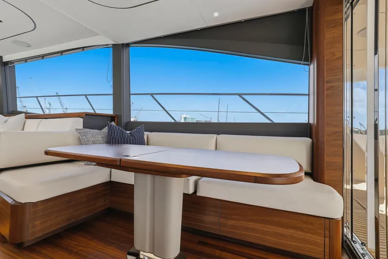 Slide: The Image of Luxurious interior of 2026 Princess F65 yacht with elegant seating and wooden accents. - 42