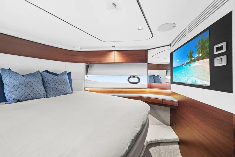 Slide: The Image of Luxurious interior of 2026 Princess F65 yacht with modern bedroom and scenic TV display. - 51