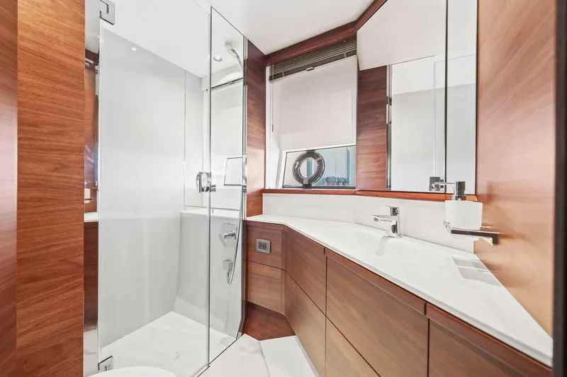Slide: The Image of Luxurious bathroom in 2026 Princess F65 yacht with sleek wood finishes and modern fixtures. - 56