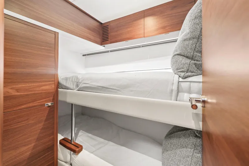 Slide: The Image of Bunk beds in 2026 Princess F65 yacht cabin with wooden finish. - 57