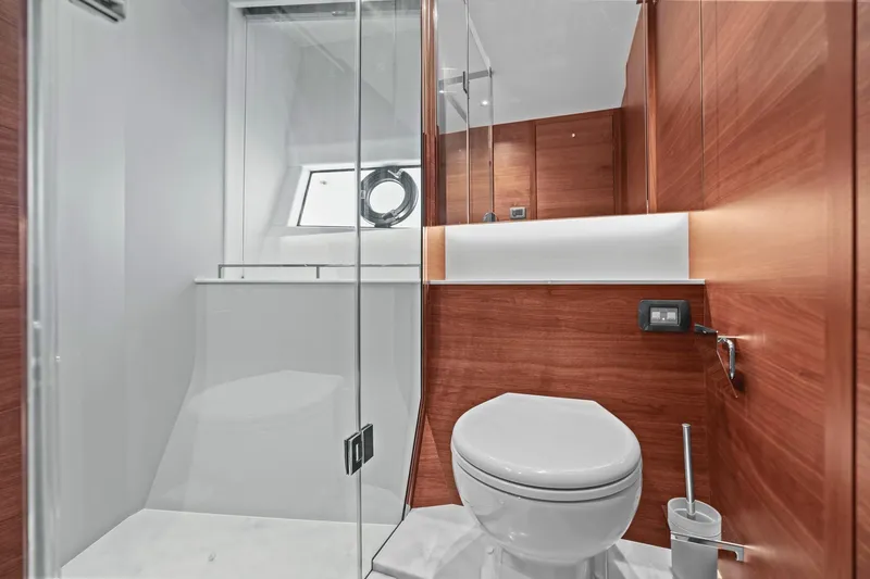 Slide: The Image of Luxurious bathroom in 2026 Princess F65 yacht with modern wood paneling and sleek fixtures. - 59
