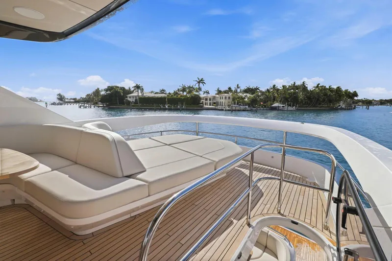 Slide: The Image of Luxurious 2026 Princess F65 yacht deck with elegant seating, overlooking serene waterfront views. - 65
