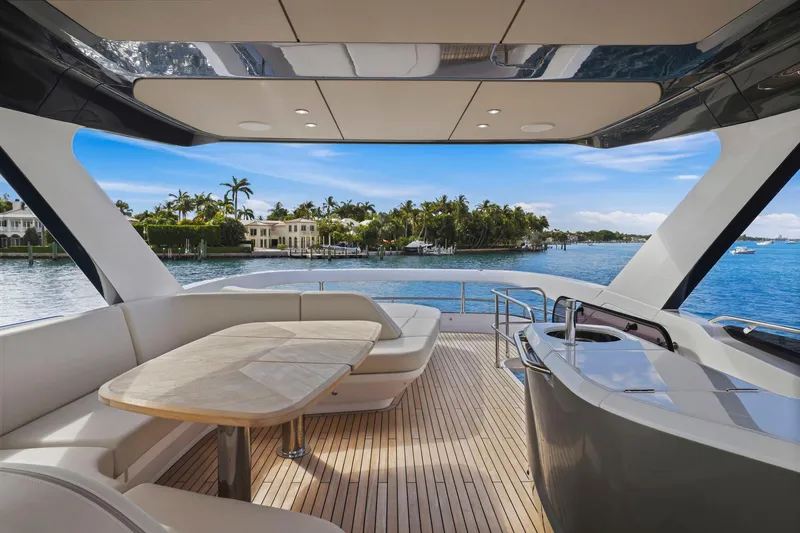 Slide: The Image of Luxurious 2026 Princess F65 yacht deck with elegant seating and stunning waterfront view. - 67