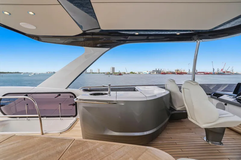 Slide: The Image of Luxurious 2026 Princess F65 yacht interior with sleek design and waterfront view. - 68