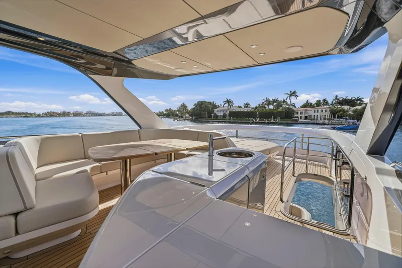 Slide: The Image of Luxurious 2026 Princess F65 yacht deck with seating, table, and ocean view. - 75