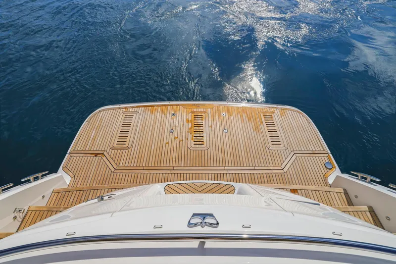 Slide: The Image of Sleek teak deck of 2026 Princess F65 yacht overlooking calm blue waters. - 77