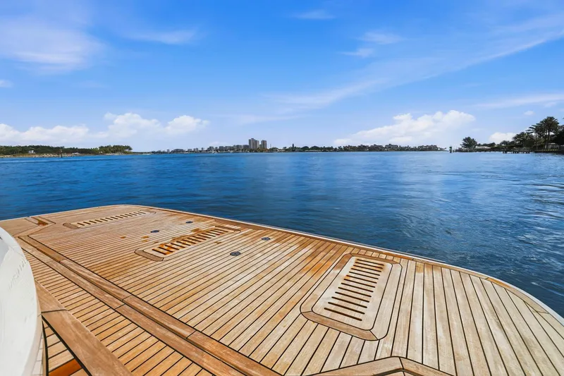 Slide: The Image of Luxurious 2026 Princess F65 yacht deck overlooking serene blue waters and clear sky. - 78