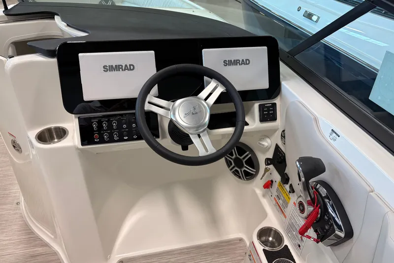Slide: The Image of 2026 Sea Ray SDX 230 helm with Simrad displays and modern controls. - 10