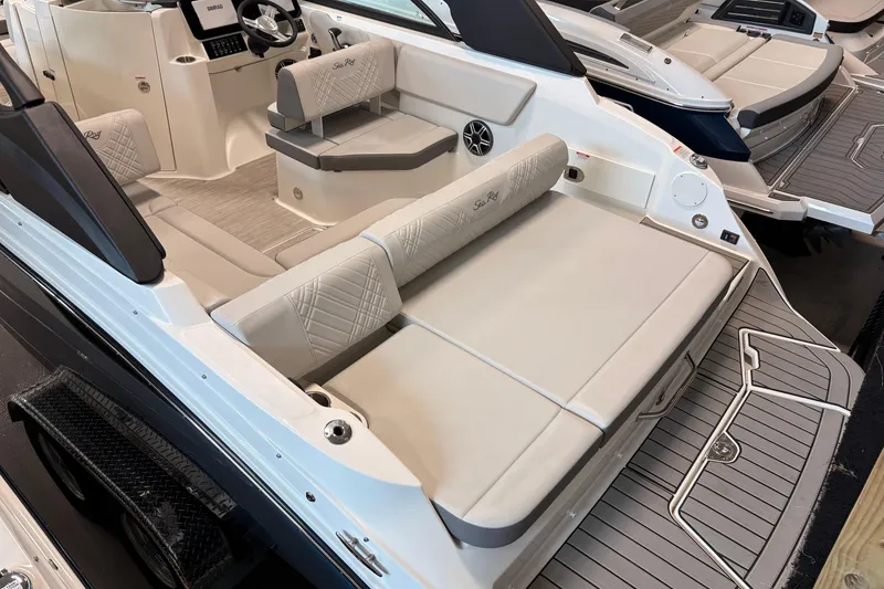 Slide: The Image of 2026 Sea Ray SDX 230 boat interior with luxurious seating and modern design. - 3