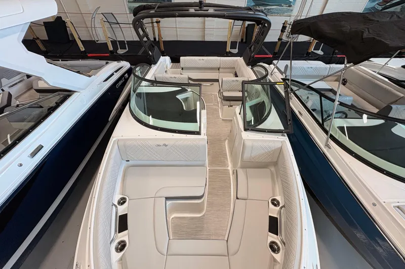 Slide: The Image of 2026 Sea Ray SDX 230 boat interior with spacious seating and modern design. - 4