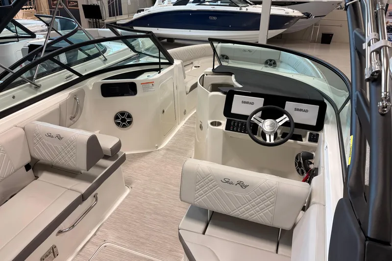 Slide: The Image of 2026 Sea Ray SDX 230 boat interior with modern dashboard and seating. - 7