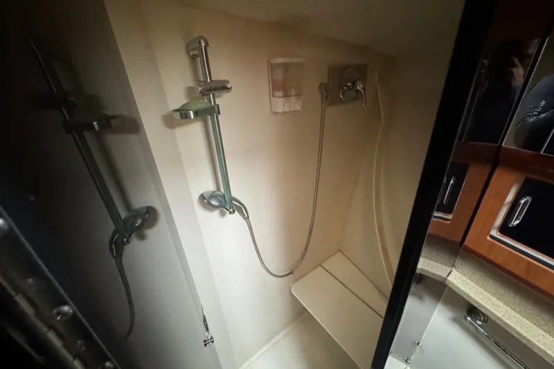 Slide: The Image of Shower area in 2008 Luhrs 41 Open boat, featuring modern fixtures and seating. - 72