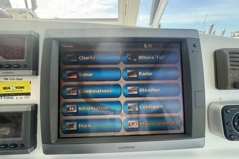 Slide: The Image of Garmin GPS display on 2008 Luhrs 41 Open boat, showing navigation and weather options. - 48