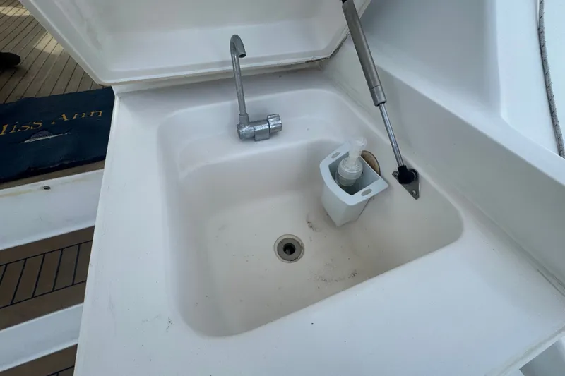 Slide: The Image of Sink area on 2008 Luhrs 41 Open boat with faucet and soap dispenser. - 32