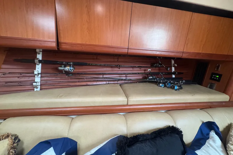 Slide: The Image of Interior of 2008 Luhrs 41 Open boat with fishing rods stored above cushioned seating. - 83