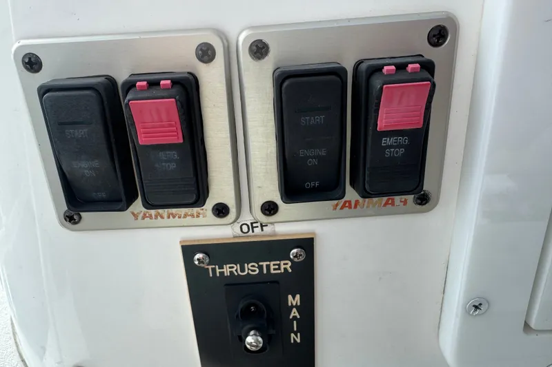 Slide: The Image of Control panel of a 2008 Luhrs 41 Open boat with engine and thruster switches. - 54