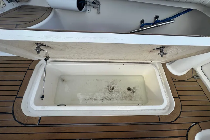 Slide: The Image of Open storage compartment on 2008 Luhrs 41 Open boat with teak flooring. - 21