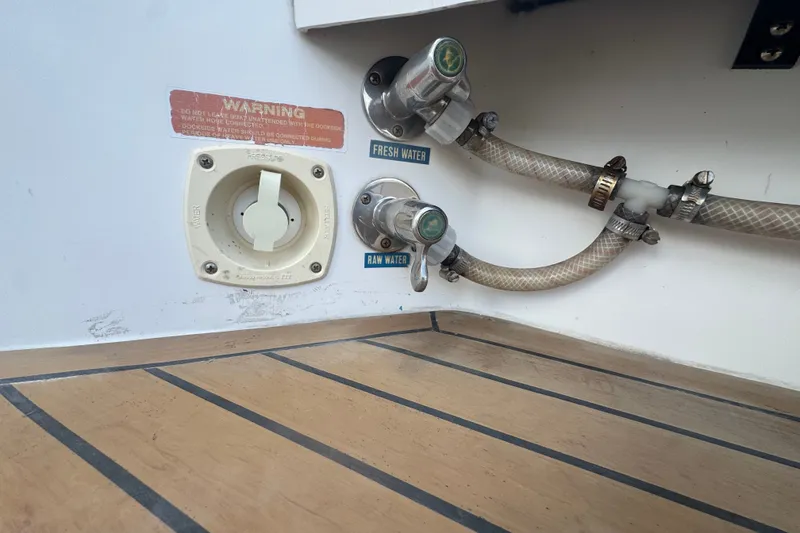 Slide: The Image of Fresh and raw water connections on 2008 Luhrs 41 Open boat deck. - 23