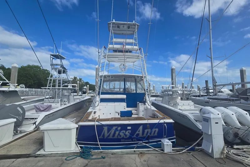 Slide: The Image of 2008 Luhrs 41 Open yacht docked at marina under blue sky. - 4