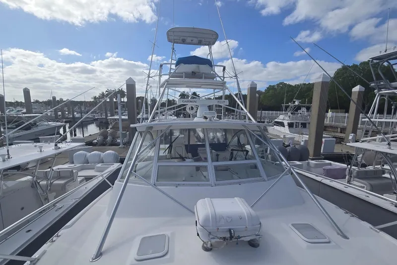 Slide: The Image of 2008 Luhrs 41 Open yacht docked at marina under a partly cloudy sky. - 5