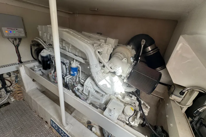 Slide: The Image of Engine room of a 2008 Luhrs 41 Open boat, featuring a Yanmar engine. - 97