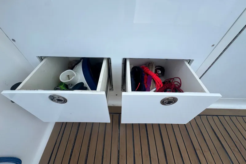 Slide: The Image of Open storage drawers on 2008 Luhrs 41 Open boat, containing various marine equipment. - 30
