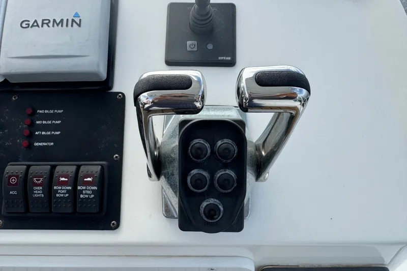Slide: The Image of Control panel of a 2008 Luhrs 41 Open boat with Garmin navigation system. - 49