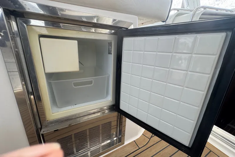 Slide: The Image of Open refrigerator on 2008 Luhrs 41 Open boat, showing interior storage space. - 60