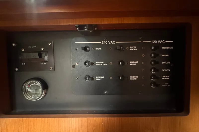 Slide: The Image of Electrical panel of a 2008 Luhrs 41 Open boat, showing 240/120 VAC switches. - 94