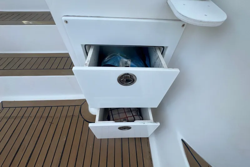 Slide: The Image of Storage drawers on 2008 Luhrs 41 Open boat with teak flooring. - 34