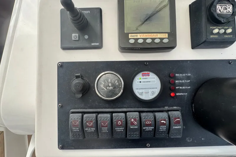 Slide: The Image of Control panel of a 2008 Luhrs 41 Open boat with switches and gauges. - 57