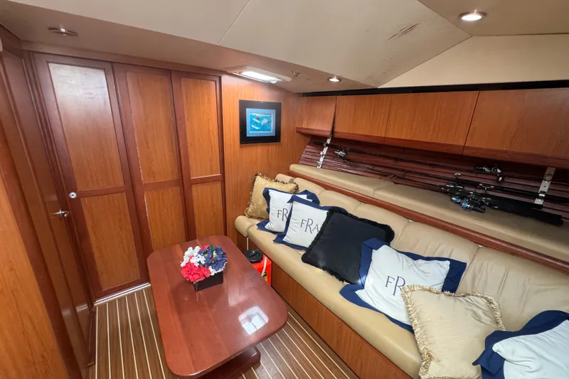 Slide: The Image of Luxurious interior of 2008 Luhrs 41 Open yacht with cozy seating and fishing rods. - 64