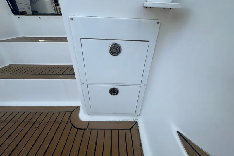 Slide: The Image of 2008 Luhrs 41 Open boat interior with teak flooring and storage compartments. - 33