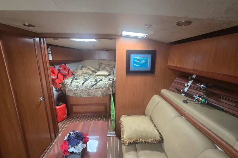 Slide: The Image of Luxurious 2008 Luhrs 41 Open cabin interior with cozy bed and fishing gear. - 8