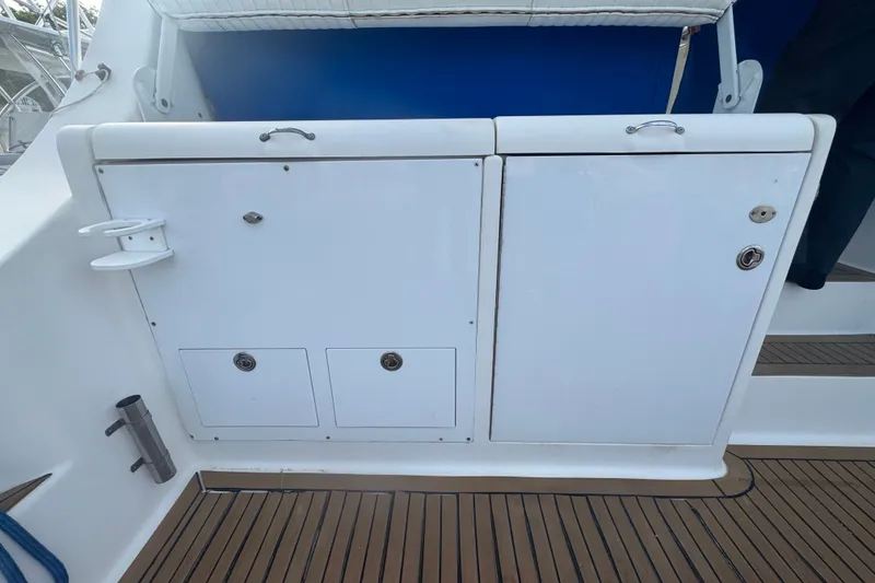 Slide: The Image of 2008 Luhrs 41 Open boat deck with storage compartments and teak flooring. - 27