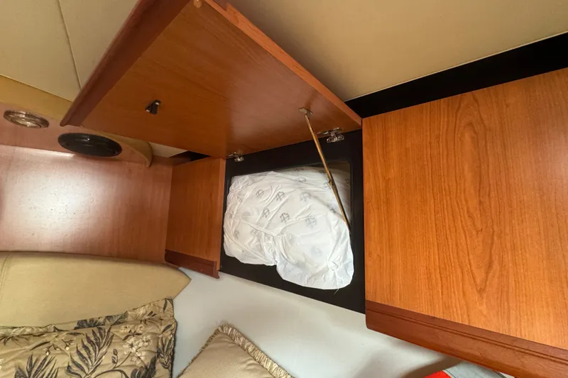 Slide: The Image of Open wooden cabinet in 2008 Luhrs 41 Open boat interior. - 66