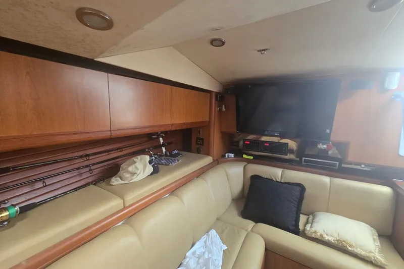Slide: The Image of Interior of 2008 Luhrs 41 Open yacht with beige seating and fishing rods. - 9